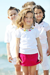 Image showing happy child group playing  on beach