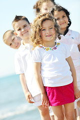 Image showing happy child group playing  on beach