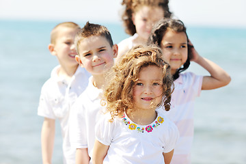 Image showing happy child group playing  on beach