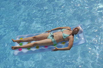 Image showing woman relax at swimming pool 