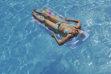 Image showing woman relax at swimming pool 