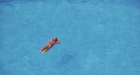 Image showing woman relax at swimming pool 