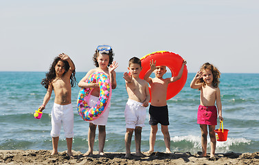 Image showing child group have fun and play with beach toys