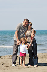 Image showing happy young family have fun on beach