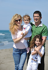 Image showing happy young family have fun on beach