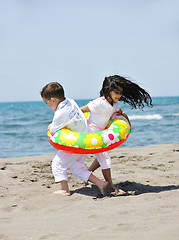 Image showing happy young  people group have fun on beach