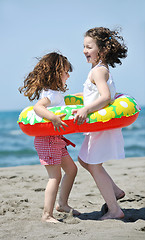 Image showing happy young  people group have fun on beach