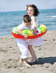 Image showing happy child group playing  on beach