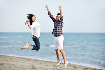 Image showing happy young couple have fun on beach