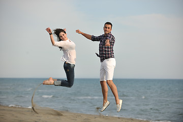 Image showing happy young couple have fun on beach