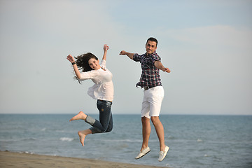 Image showing happy young couple have fun on beach