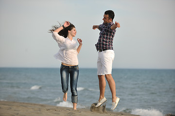 Image showing happy young couple have fun on beach