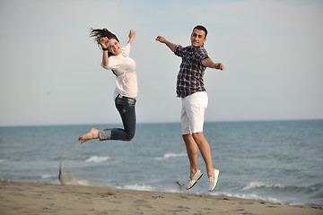 Image showing happy young couple have fun on beach