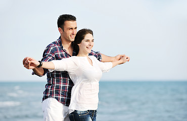 Image showing happy young couple have fun on beach