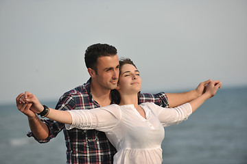 Image showing happy young couple have fun on beach