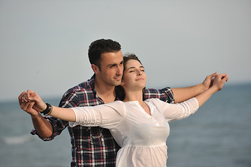 Image showing happy young couple have fun on beach