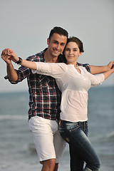 Image showing happy young couple have fun on beach