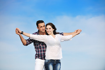 Image showing happy young couple have fun on beach