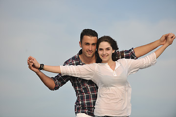 Image showing happy young couple have fun on beach