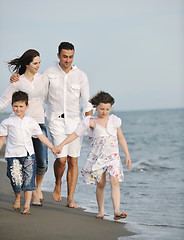 Image showing happy young family have fun on beach