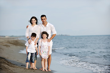 Image showing happy young family have fun on beach