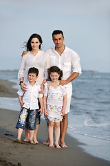 Image showing happy young family have fun on beach