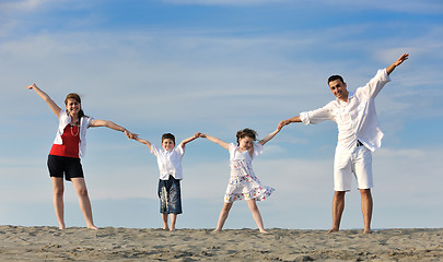 Image showing happy young family have fun on beach