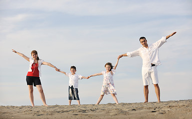 Image showing happy young family have fun on beach