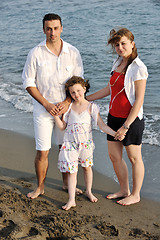 Image showing happy young family have fun on beach