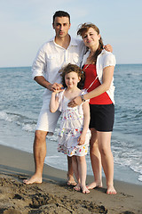 Image showing happy young family have fun on beach