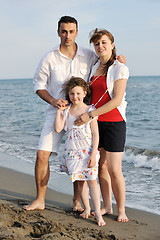 Image showing happy young family have fun on beach