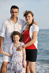 Image showing happy young family have fun on beach