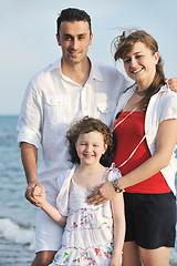 Image showing happy young family have fun on beach