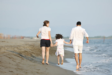 Image showing happy young family have fun on beach