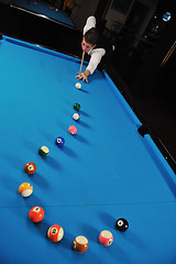 Image showing young man play pro billiard game 