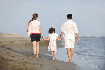 Image showing happy young family have fun on beach