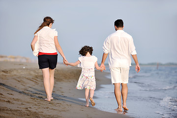 Image showing happy young family have fun on beach