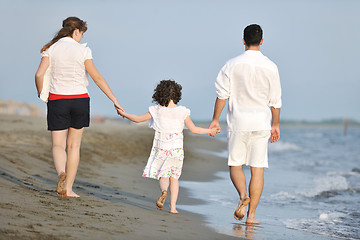 Image showing happy young family have fun on beach