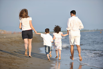 Image showing happy young family have fun on beach