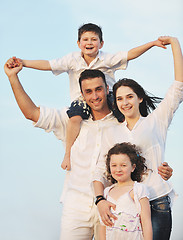 Image showing happy young family have fun on beach