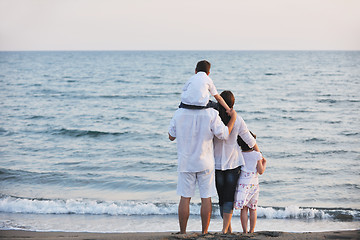 Image showing happy young family have fun on beach