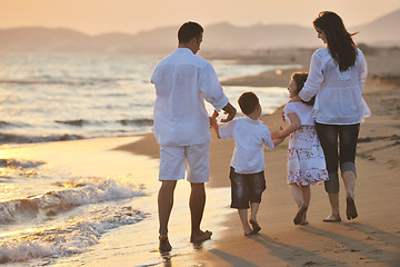 Image showing happy young family have fun on beach at sunset