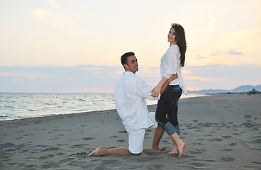 Image showing happy young couple have fun on beach