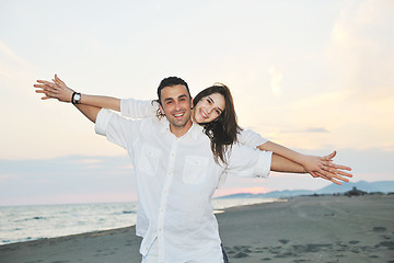 Image showing happy young couple have fun on beach