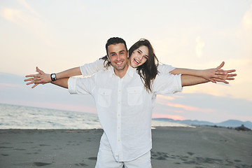 Image showing happy young couple have fun on beach