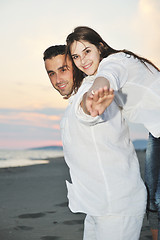 Image showing happy young couple have fun on beach