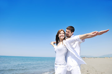 Image showing happy young couple have fun on beach