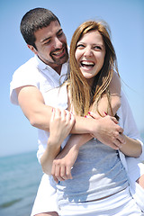 Image showing happy young couple have fun on beach