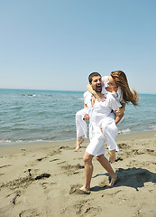 Image showing happy young couple have fun on beach