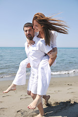 Image showing happy young couple have fun on beach